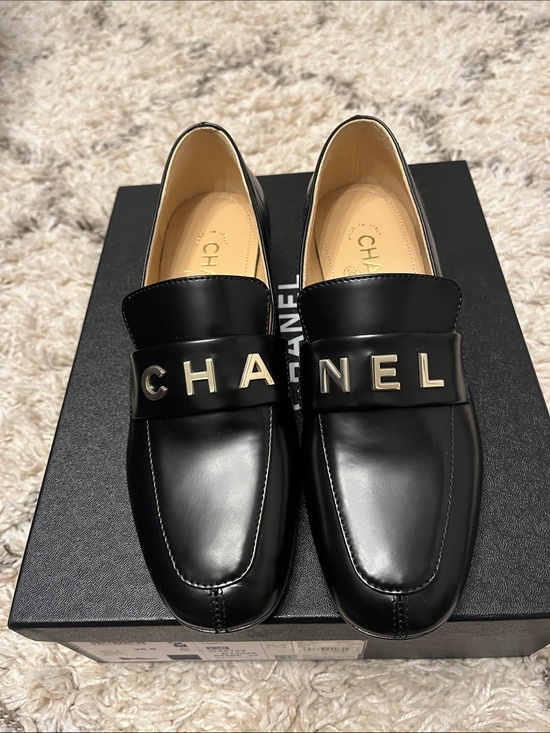 Shoes - Chanel black loafers. Shiny calfskin and metal. Size 36.5. New in box.